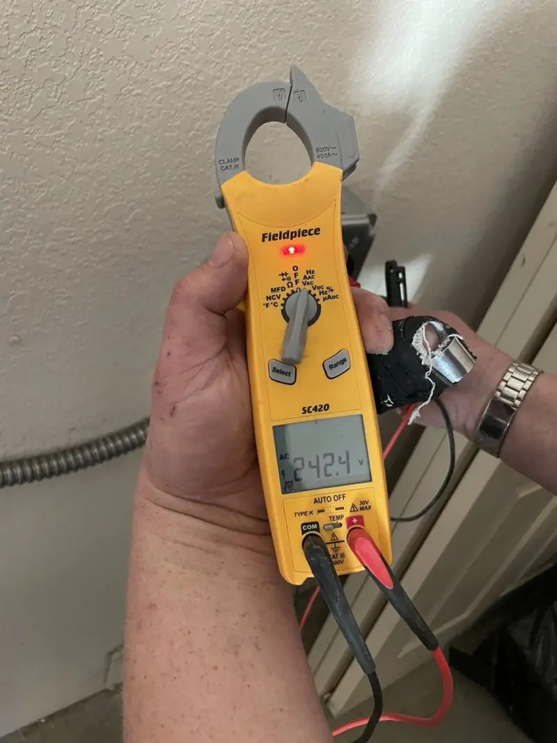 Voltage testing with clamp meter during Generator Installation in Amelia